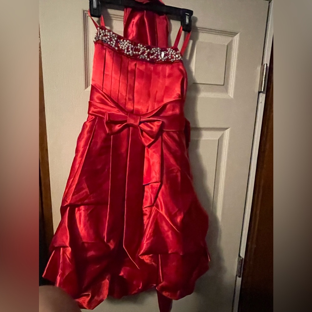 Girls red formal dress size 12. Worn briefly for a pageant.